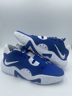 a pair of blue and white nike shoes