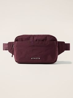 a purple fanny bag with the word athleta on it's front pocket