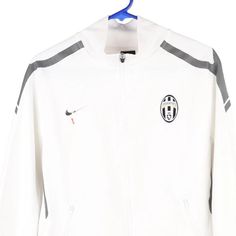 Description:Vintage Age 18 Juventus white Nike track jacket, fits x-large.GENDER: boys CONDITION: good - logo fading on front.STYLE: track jacketERA: 1990sCOLOUR: whiteFABRIC: polyester White Sporty Outerwear With Logo Detail, Sporty White Outerwear With Logo Detail, White Sports Outerwear With Three Stripes Branding, White Track Jacket With Three Stripes For Sports Season, White Track Jacket With Three Stripes Branding, White Crew Neck Outerwear For Sports Season, Casual White Track Jacket With Three Stripes Branding, White Track Jacket For Winter Streetwear, White Crew Neck Sporty Track Jacket