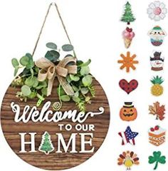 a wooden sign that says welcome to our home with decorations around it and hanging on the wall