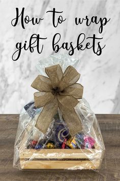 Wrapped gift basket Gift Basket Ribbon Wrapping Ideas, Gift Baskets Wrapping Ideas, How To Clear Wrap A Gift Basket, How To Wrap Baskets Gift, Christmas Gift Basket Wrapping Ideas, Wrapping A Basket Gift, Wrap Gift Basket, How To Make A Bow For A Gift Basket, Christmas Basket Wrapping Ideas