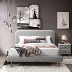 a bedroom with grey walls and pictures on the wall above the bed, along with two nightstands