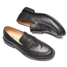 Upgrade your footwear collection with the LeatherLux Modish Slip On Penny Loafers, the perfect blend of style, comfort, and durability. Crafted with genuine cow leather, these loafers offer a luxurious feel and long-lasting wear. Slip into these versatile loafers and make a statement with every step you take. Slip-on Leather Shoes With Round Toe For Business Casual, Business Loafers With Leather Footbed And Round Toe, Business Slip-on Tassel Loafers With Round Toe, Business Loafers With Brogue Detailing And Round Toe, Business Casual Loafers With Rubber Sole And Round Toe, Business Loafers With Brogue Detailing, Slip-on Tassel Loafers With Round Toe For Business Casual, Business Slip-ons With Brogue Detailing And Flat Heel, Slip-on Tassel Loafers For Business Casual