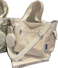 Casual Large Capacity Satchel For Study, Large Capacity Shoulder Bag For Study, White Large Capacity Shoulder Bag For Study, Large Capacity Canvas Diaper Bag For School, White Bag With Multiple Pockets For Daily Use, White Bags With Multiple Pockets For Daily Use, White Bag With Multiple Pockets For Everyday Use, White Shoulder Bag With Multiple Pockets For Travel, Style Preppy