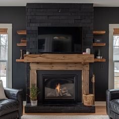 Please do not purchase a Mantel or shelves without first filling out the Quote Form and receiving a quote from us. Quote Form: https://form.jotform.com/240524957086059 Transform your fireplace into a focal point of rustic elegance with our Reclaimed Wood Beam Fireplace Mantels with Matching Shelves collection. Crafted from exquisite reclaimed pine wood beams, each mantel radiates timeless charm and character, while the accompanying shelves offer both aesthetic appeal and practical functionality. Home Interior Design Dark Wood, Black Chalk Paint Fireplace, Fireplace With Hearth Seating, Black Wall With Fireplace, Fireplace With Tile Hearth, Black Brick Fireplace Painted, Rustic Living Room Wall Decor Ideas, Urbane Bronze Fireplace, Black Walls Interior