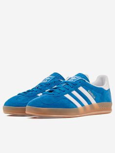 A remake of the 1979 Gazelle Indoor, the sneakers most favored by soccer fans and sneakerheads alike. A blue suede upper and durable leather lining combine with a translucent rubber outsole. The 3 stripes and gold metallic lettering complete the iconic look.
  Suede upper
 Lace-up closure
 Leather lining
 Rubber sole
 Blue



Size & Fit:
Fit regular Blue Adidas Custom Sneakers For Streetwear, Urban Blue Sneakers With Contrast Sole, Blue Urban Sneakers With Contrast Sole, Blue Urban Custom Sneakers With Contrast Sole, Urban Style Blue Custom Sneakers With Boost Midsole, Blue Custom Adidas Sneakers With Round Toe, Blue Adidas Custom Sneakers With Round Toe, Blue Urban Sneakers With Translucent Outsole, Blue Casual Custom Sneakers With Translucent Outsole