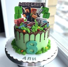 a birthday cake decorated with minecraft characters