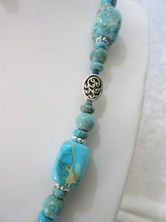 This necklace is a blend of turquoise and turquoise jasper ( don't know for sure what that term means but that is how the beads were labeled and they were pricy). Pewter fillegree ovals and silver plated rondelles were used as spacers. The necklace is 20 inches long with a 3 inch extender. The swivel lobster clasp is silver plated. The earrings dangle one inch from the loops of the silver plated ear wires and are made with 8mm and 6mm rounds and pewter beads. This set will be slipped into an org Turquoise Necklace With Lobster Clasp And Round Beads, Turquoise Necklace With Lobster Clasp For Jewelry Making, Jasper Jewelry, Leverback Earrings, One Inch, Earrings Dangle, Ear Wires, Necklace Set, Jewelry Set