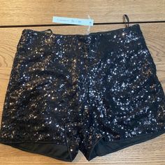 New Never Used. Black Sequin Shorts Party Pants With Built-in Shorts, Short Length Bottoms With Built-in Shorts For Night Out, Sequined High-waisted Shorts For Night Out, High Waist Sequin Shorts For Night Out, Black Party Bottoms With Short Inseam, Black Party Bottoms Short Inseam, High-waist Sequined Shorts For Night Out, Black Shorts For Night Out, Trendy Party Bottoms With Short Inseam