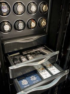 a watch display in the back of a truck with lots of watches on it's shelves