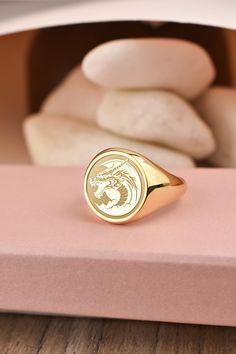 Welcome to LUXJ, Here you will find a beautiful selection of round signet rings with a variety of designs such as our dragon signet ring. Our team is happy to assist you with any questions you may have and we look forward to creating these special jewelry for you. *The images are taken from us and you will receive your ring as shown* | Information about the ring | - Face Size: 14x14mm - Band width at the bottom: 4mm | Material | - Sterling Silver 925 - Gold Vermail (925 base) - 9K Real Gold (375 Dragon Signet Ring, Engraved Round Signet Ring Collectible, Polished Round Signet Ring Collectible, Round Signet Ring With Polished Finish For Collectors, Polished Finish Round Signet Ring Collectible, Symbolic Yellow Gold Round Signet Ring, Symbolic White Gold Signet Ring, Gold Symbolic Signet Ring, Gold Round Signet Ring Collectible