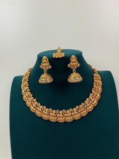 This exquisite piece of craftsmanship comes from our Traditional collection. Very Elegant and stylish, this necklace can be paired with any Attire depending upon the occasion and the theme. Finish: 24 grams gold finish Necklace Fastening: Adjustable Dori Earring Fastening: Push Back Contains: 1 necklace, 1 pair of earrings Luxury Temple Necklace With Cutdana For Celebration, Luxury Round Temple Necklace For Festive Occasions, Luxury Heavy Temple Necklace For Puja, Luxury Hallmarked Yellow Gold Temple Necklace, Luxury Hallmarked Temple Necklace For Diwali, Kameswari Jewellers Dasavataram Necklace, Guttapusalu Necklace, Jewelry Indian Wedding, Temple Jewelry