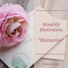 pink flower sitting on top of two envelopes with the words, month of motivation memories