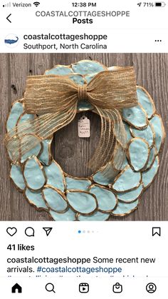 a blue and gold wreath with a bow on it