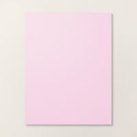 a pink square paper on a white wall