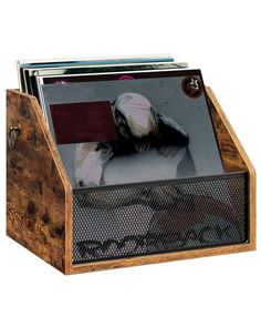 a wooden magazine holder with an image of a dog on the front and back sides