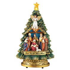 a christmas tree with angels on it and an angel above the top, is shown