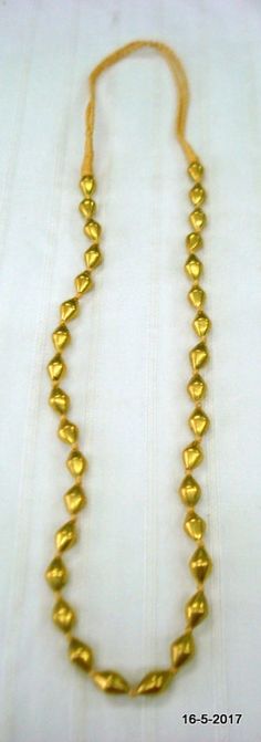 Vintage antique tribal old 22kt Gold Beads Necklace mala from Rajasthan India. great handmade design good for jewellery collection.Note - There is wax inside the gold beads. Gold Beads are filled with wax inside. Length - 79 cm (31") we can adjust the Length. Size of each bead (approx) - 1.3/0.7 cmGross weight - 24.5 grams Material - 22kt Yellow Gold,wax inside. 22k Gold Necklaces For Puja, Gold Kundan Necklace For Puja In 22k Gold, Gold Temple Jewelry Necklaces With Latkans, Gold Necklaces With Latkans For Festive Occasions, Gold 22k Kundan Necklace For Puja, Gold Beaded Necklace With Large Beads For Festive Occasion, Festive Gold Necklaces With Latkans, Temple Jewelry Necklaces With Gold Beads For Celebrations, Festive Gold Mala As Gift