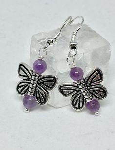 Amethyst butterfly earrings, amethyst earrings, amethyst jewelry, purple stone earrings, butterfly j Purple Earrings With Natural Stones, Purple Natural Stones Round Earrings, Round Purple Earrings With Natural Stones, Lavender Earrings With Natural Stones For Gift, Elegant Purple Butterfly Earrings, Purple Dangle Jewelry With Butterfly Charm, Amethyst Natural Stone Earrings For Gift, Amethyst Natural Stone Earrings As Gift, Amethyst Earrings With Natural Stones For Gift