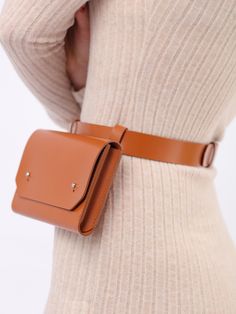 Handcrafted from smooth Italian leather, the Envelope Belt Bag will easily complete any outfit. A mix of style and practicability, the piece can be worn with a bodycon dress or oversized blazer for a chic look. With a modern and minimalist aesthetic, the adjustable belt allows for a customized fit while the slim envelope bag comfortably sits around the waist. Generous in size, it can securely hold your phone, wallet or other essential items. Waist Bag Size: Height- 11 cm, Width- 17.5 cm, Depth – Belt Bag Diy, Harness Bag, Dog Accesories, Double Belt, Micro Bag, Leather Belt Bag, Leather Harness, Belt Bags, Envelope Bag