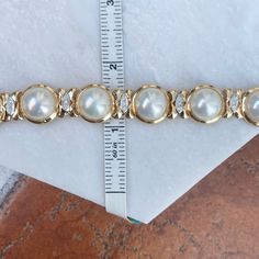 Estate/ vintage 14KT yellow gold polished, Mabe pearl links with diamond detailing bracelet. Elegant and high-end piece! Length: 7" Width: 15mm Weight: 42.6 grams Finished back Push in Clasp Double Safety Clasp .59 carat pave diamonds (27) round diamonds SI clarity; G/H color color diamonds Excellent estate condition Classic Diamond Pearl Bracelet For Formal Occasions, Formal Diamond Pearl Bracelet With Jubilee Style, Formal Round Diamond Pearl Bracelet, White Diamond Pearl Bracelet For Anniversary, White Pearl Diamond Bracelet For Anniversary, Gold Diamond Pearl Bracelet For Anniversary, Diamond Pearl Bracelet In Yellow Gold For Anniversary, Yellow Gold Diamond Pearl Bracelet For Anniversary, Classic Gold Diamond Pearl Bracelet