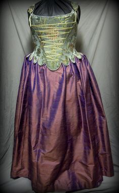 Exemplify seventeenth century elegance in a rich corset and silk skirt made to your measurements in the colors of your choice. FABRICS IN PHOTOS ARE EXAMPLE ONLY- we will consult with you on custom fabrics to choose from This ensemble includes our c. 1660 Corset, full skirt, and 17th c. bum roll. (Brooch shown is not included, listing is for corset, skirt and pad only) You choose the fabrics and colors: For the corset and skirt, the buyer may choose to provide the fabric (7 yards for the skirt, Regency Style Wedding Corset With Historical Design, Regency Style Historical Wedding Corset, Regency Corset Dress With Fitted Bodice, Regency Style Fitted Bodice With Corset Back, Regency Style Overbust Corset Dress, Regency Overbust Bodice For Costumes, Regency Style Fitted Corset Dress With Boned Bodice, Historical Underbust Corset Dress For Wedding, Regency Style Overbust Bodice For Costume