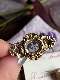 Antique Georgian era brooch from North of Europe. There are signs of repair and the pin has been substituted in a more recent time. Also the central intaglio was once a locket but the opening has been removed. This could have been a mourning or sentimental jewel. The central glass intaglio represents Love (heart), Faith (cross) and Hope (anchor). DETAILS: Dimensions: xx cm Hallmark: no hallmarks. Tested 14ct gold. Condition: good. See description. All the items are carefully packaged with upcycl Ornate Oval Intaglio Brooches, Heirloom Oval Brooches With Intaglio, Vintage Intaglio Brooches For Anniversary, Oval Intaglio Brooches For Anniversary, Vintage Gold Intaglio Brooches, Ornate Oval Engraved Brooches, Antique Oval Engraved Brooches, Vintage Gold Brooches With Rose Cut Diamonds, Ornate Oval Brooches For Anniversary