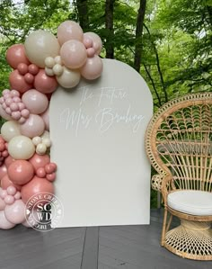 an arch made out of balloons with the words mr and mrs bridal on it