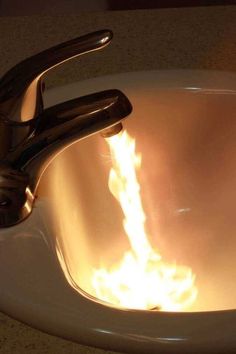 a sink that has fire coming out of it