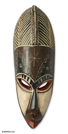 an african mask is shown on a white background