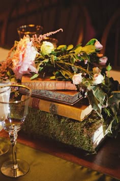 Pretty moss-covered books as centerpieces (Boston Public Library wedding reception). Photography by sweetmondayphotography.com, Coordination by thecateredaffair.com, Floral Design by twigboston.com Woodland Wedding Centerpieces, Boston Public Library Wedding, Woodland Theme Wedding, Books And Flowers, Rustic Woodland Wedding, Book Centerpieces, Literary Wedding, Books Flowers, Rustic Wedding Decorations