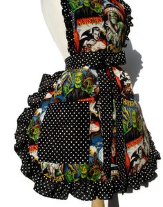 a black and white polka dot dress with monsters on it