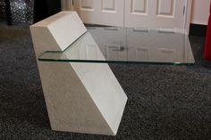 a modern glass and stone coffee table