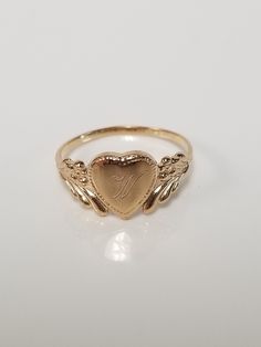 "Thanks for shopping our vintage estate store. We tend to sell well below wholesale and truly hope you enjoy all of our items. Many of the items are one of a kind, so please enjoy scrolling through the pictures and hopefully something will catch your eye. Brown spots are from camera or reflections. Estate 14k yellow gold monogram cursive capital W heart ring. Custom made ring for our shop. Ring size: 3 Setting: 7.5mm 1/4\" to 3/8\" Band width: 1.4mm Weight: 1.06 gram Marked 14k and it's sweet. O Vintage Gold Initial Ring Stamped 14k, Vintage 14k Stamped Initial Ring As Gift, Victorian Gold Initial Ring As Gift, Vintage Yellow Gold Engraved Initial Ring, Vintage Engraved Ring With Hallmarks For Wedding, Vintage Oval Engraved Ring With Initials, Vintage Engraved Promise Ring With Initials, Vintage Engraved Ring With Initials For Promise, Vintage Personalized 14k Gold Engraved Ring