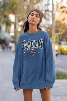 This vintage college inspired crewneck sweatshirt is the perfect gift for the football lover. * Design & Letters are slightly distressed for that vintage inspired look. * UNISEX SIZING * Fits true to size. Size up for a looser fit. * 50% cotton, 50% polyester * Pre-shrunk * Classic fit * 1x1 athletic rib knit collar with spandex * Air-jet spun yarn with a soft feel and reduced pilling * Double-needle stitched collar, shoulders, armholes, cuffs, and hem This product is made especially for you as soon as you place an order, which is why it takes us a bit longer to deliver it to you. Making products on demand instead of in bulk helps reduce overproduction, so thank you for making thoughtful purchasing decisions! Collegiate Style Sweatshirt For Football Season, Pre-shrunk Sweatshirt For Baseball Game Day, Baseball Season Sweatshirt With Graphic Print For Fans, Collegiate Sweatshirt For Game Day, Varsity Sweatshirt For Football Season Streetwear, School Spirit Graphic Sweatshirt For Baseball Season, School Spirit Graphic Print Sweatshirt For Baseball Season, College Football Season Graphic Print Sweatshirt, Collegiate Crew Neck Sweatshirt For Game Day