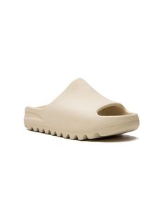 beige open toe branded insole slip-on style rubber sole Yeezy Slides Beige, Beige Textured Slip-on Slides, Comfortable Beige Open Toe Slides, Comfortable Open Toe Beige Slides, Beige Open Toe Slides With Rubber Sole, Beige Slides With Textured Footbed And Round Toe, Beige Slides With Textured Footbed, Beige Cushioned Slide Slippers, Comfortable Beige Flat Slides