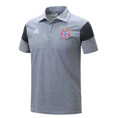 the adidas polo shirt is grey with black sleeves and an emblem on the chest