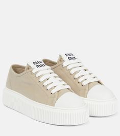 Enliven your sneaker edit with the joyful essence of Miu Miu. These low-top sneakers have cotton canvas uppers with embroidered logo patch tongues and rest on exaggerated rubber soles with a grooved texture. Miu Miu Clothes, Miu Miu Shop, Gucci Sneakers, Low Top Sneakers, Canvas Sneakers, Luxury Shoes, Valentino Garavani