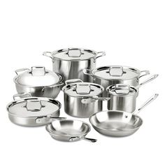 an assortment of stainless steel pots and pans