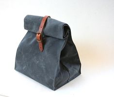 Charcoal Gray Waxed Canvas Lunch Bag Tote with leather by overlap, $48.00 Waxed Canvas Lunch Bag, Lunch Boxes For Men, Canvas Lunch Bag, Grey Gloves, Cool Lunch Boxes, Sac Lunch, Bag Ideas, Sewing Studio, Brown Bags