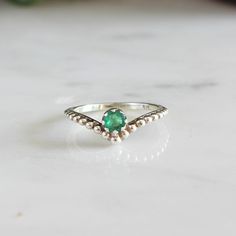 Buy the matching stacking ring at https://etsy.me/36T2mKg About The Stone Emeralds are the stone of successful love, and the birthstone for May. It is a precious gemstone, known to bring prosperity and wisdom to those who wear it. It is also said to enhance creativity and improve physical health. About The Product A simplistic but evergreen design, this stacking ring has a beautiful prong set Emerald in the center of the V shaped design and a designer band. Perfect for everyday wear! This ring i Improve Physical Health, Smaragd Ring, Stackable Rings Silver, Handcrafted Silver Jewelry, Silver Stacking Rings, Natural Stone Jewelry, May Birthstone, Emerald Stone, Stackable Ring