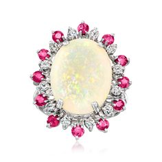 Ross-Simons - C. 1970 Vintage Opal, 1.20ct t. w. Ruby, 30ct t. w. Diamond Cocktail Ring Oval Cut Size 6.5. C. 1970. Elegant with the perfect dose of color, this Estate collection cocktail ring is the perfect piece for sprucing up old ensembles. Features a 16x12mm oval opal cabochon showing off its iridescent array of colors amid a sparkling halo of 1.20 ct. t. w. round rubies and .30 ct. t. w. round brilliant-cut diamonds. Crafted in 14kt white gold. 1" wide. Diamond, ruby and opal cocktail ring Clear Sunglasses Frames, Jewelry Presentation, Antique Jewelry Rings, Vintage Cocktail Ring, Diamond Cocktail Ring, Fine Jewelery, Diamond Cocktail Rings, Ruby Stone, Ruby Diamond