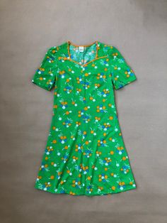 Vintage green mini dress with blue and orange flower pattern, short sleeved in soft jersey.  Estimated size S, Made in Sweden by Vinetta, marked VDN (the Swedish Institute for Informative Labelling, used 1951-1973) Measurements To help make sure the item will fit; use a soft tape measure and compare these with your own or on an item in a similar style. These measurements are just a guide, if you are uncertain please contact us with your measurements and we can advise best fit. Shoulders: 32cm Chest: 42cm x 2 Waist: 37cm x 2 Length: 87cm Any questions? Send us a dm! Scandinavian Green, Vintage Mini Dress, Vintage Mini Dresses, Green Floral Pattern, 60s Mod, Green Mini Dress, 60s Dress, Swedish Design, Orange Flower