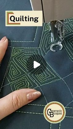 someone is stitching on the side of a piece of fabric with their thumbnails