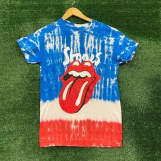 The Rolling Stones No Filter Tour Tie Dye T-Shirt Size Small Measures 18 Inches Pit To Pit 27 Inches Long Amazing T-Shirt Unique Tie Dye Pattern With Graphics On Both Sides Of The Shirt Perfect For Fans Of The Legendary Band The Rolling Stones New Never Worn In Great Condition Blue Screen Print T-shirt For Concert, Blue Sublimation Print Tops For Fans, Band Merch Blue T-shirt With Sublimation Print, Blue Band Merch T-shirt, Blue Band Merch Top With Sublimation Print, Multicolor Band Merch Tops For Summer, Multicolor Casual Tops For Concert, Blue Band Merch Shirt With Screen Print, Casual Multicolor Tops For Concert