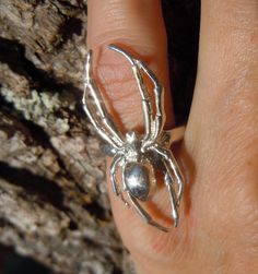 Just in time for Halloween, we offer this spider ring. It is made of solid sterling silver and measures 40mm long X 15 mm wide. We can make it to fit any size finger. This would be the perfect finishing touch to any Halloween costume or be a great addition to your fun jewelry collection. While puzzle rings are our specialty, we offer a wide range of non-puzzle rings and other jewelry in a variety of motifs. We carry rings for animal lovers, motorcycle enthusiasts, horse aficionados, and many oth Widow Ring, Puzzle Rings, Spider Ring, The Black Widow, Wedding Puzzle, Puzzle Ring, Spider Jewelry, Art Jewelry Contemporary, Fun Jewelry