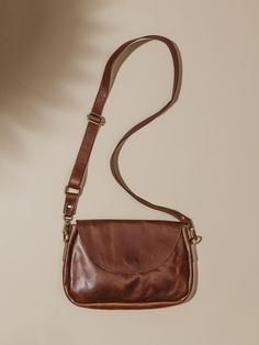 This brown leather crossbody bag is handcrafted using remnant leather rescued from Indian fashion markets – a true embodiment of style, sustainability, and versatility. With a fully adjustable crossbody strap, you’ll find new ways to wear this beauty on all of your adventures. And with ample space and a unique exterior zipper pocket you’ll have everything you need at your fingertips! Brown Crossbody Purse, Brown Leather Crossbody Bag, Brown Crossbody, Fashion Marketing, Leather Crossbody Purse, Large Fashion, Crossbody Purse, Fast Fashion, Crossbody Strap