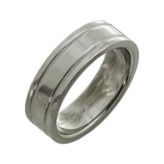 This fabulous Tiffany & Co. unisex wedding band is crafted in fine platinum and elegantly accented with milgrain edges. Classic and timeless. Made in United States circa 2010s. Measurements: 0.23" (6mm) width. The ring size is 7.5 - EU 56. Non-resizable.