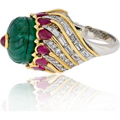 Embrace the confluence of artistry and allure with the David Webb Platinum & 18K Yellow Gold Mughal Carved Emerald and Ruby Ring, a mesmerizing testament to timeless elegance and sophistication. This exquisite ring is not just jewelry; it's a piece of history, exuding a captivating charm that transcends trends.At the heart of this masterpiece lies a meticulously carved Mughal emerald, each facet telling a story of ancient allure and prestige. Nestled alongside is a collet-ruby, adding a regal touch that speaks of royalty and grace. The combination of these gemstones creates a harmonious symphony of colors, each hue complementing the other in a dance of radiance.Encased within a mount of 18K yellow gold, this ring is adorned with round and baguette diamonds, totaling approximately 2.25 cara History Jewelry, Carved Emerald, Ruby Birthstone, David Webb, The David, Baguette Diamonds, Creating Jewelry, Ruby Ring, Baguette Diamond