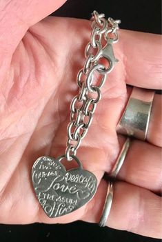 8  1/4" long 925 Silver Bracelet stamped on Heart charm & bracelet chain: 925 LA, 925 Italy. Heart charm is 1" x 1". Written on heart in various fonts are Love, Peaceful, Angel, Live, Courage, Hug, Treasure & XOXO. 925 Silver Bracelet, Bracelet Chain, Heart Charm Bracelet, Charm Bracelets, Silver Heart, Heart Charm, 925 Silver, Silver Bracelet, Beauty Book